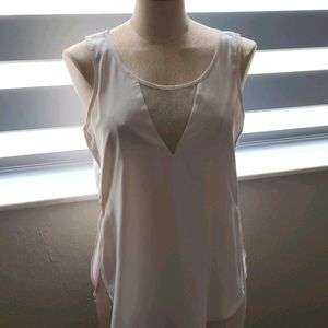 White sleeveless top with low cut mesh insert